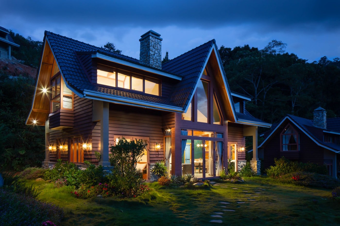 A warmly lit, energy-efficient Warwick home at dusk